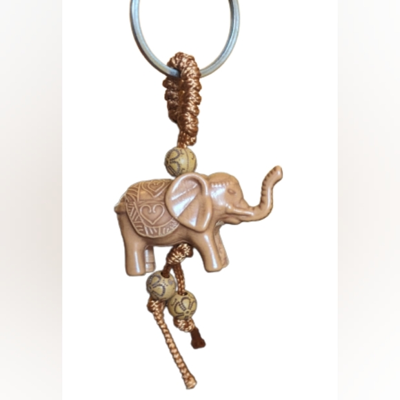 NEW tan carved poly resin elephant w/designs carved in the sides on a looped - Picture 2 of 3